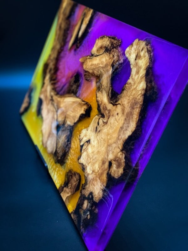 An epoxy resin tray made with different epoxy colorants swirled together.